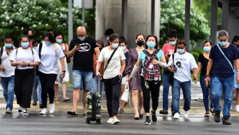 Singapore advises wearing masks amid sharp rise in COVID cases